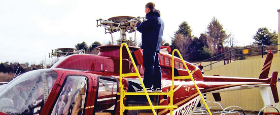 helicopter mechanic changing blades